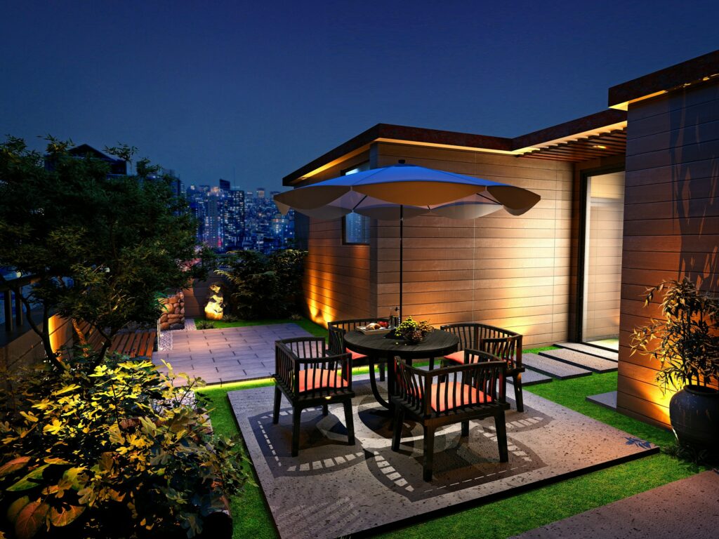 A wooden deck with a table, chairs, and safeguard against power surges in its electrical systems.